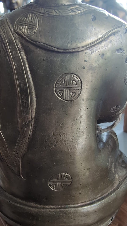 Close-up of engraved Shou medallions across the back of the robe