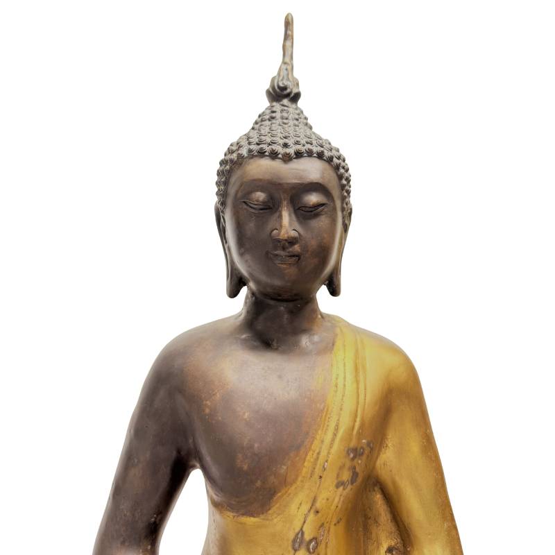 Close-up of the Buddha's face, flame-shaped ushnisha and worn gilding
