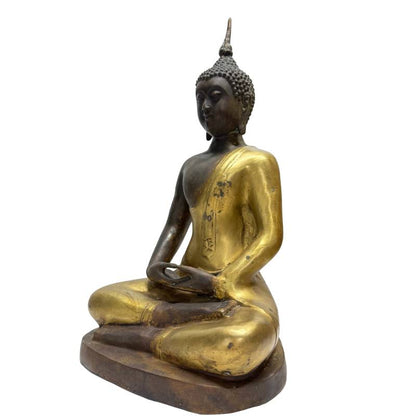 Opposite front angle showing crossed legs and meditative hands