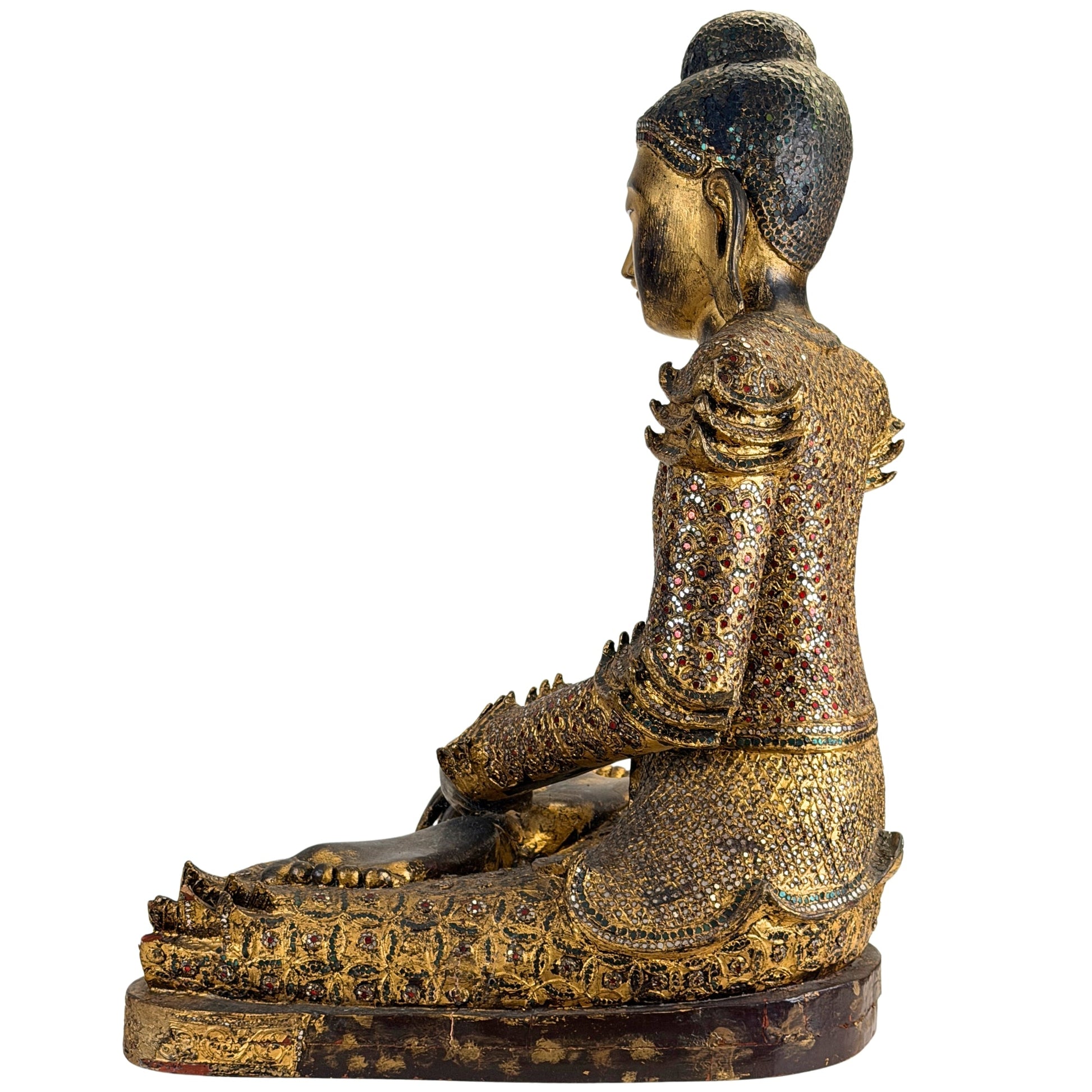 Ornamental mirrorwork and gilded decoration on the Burmese Mandalay Buddha