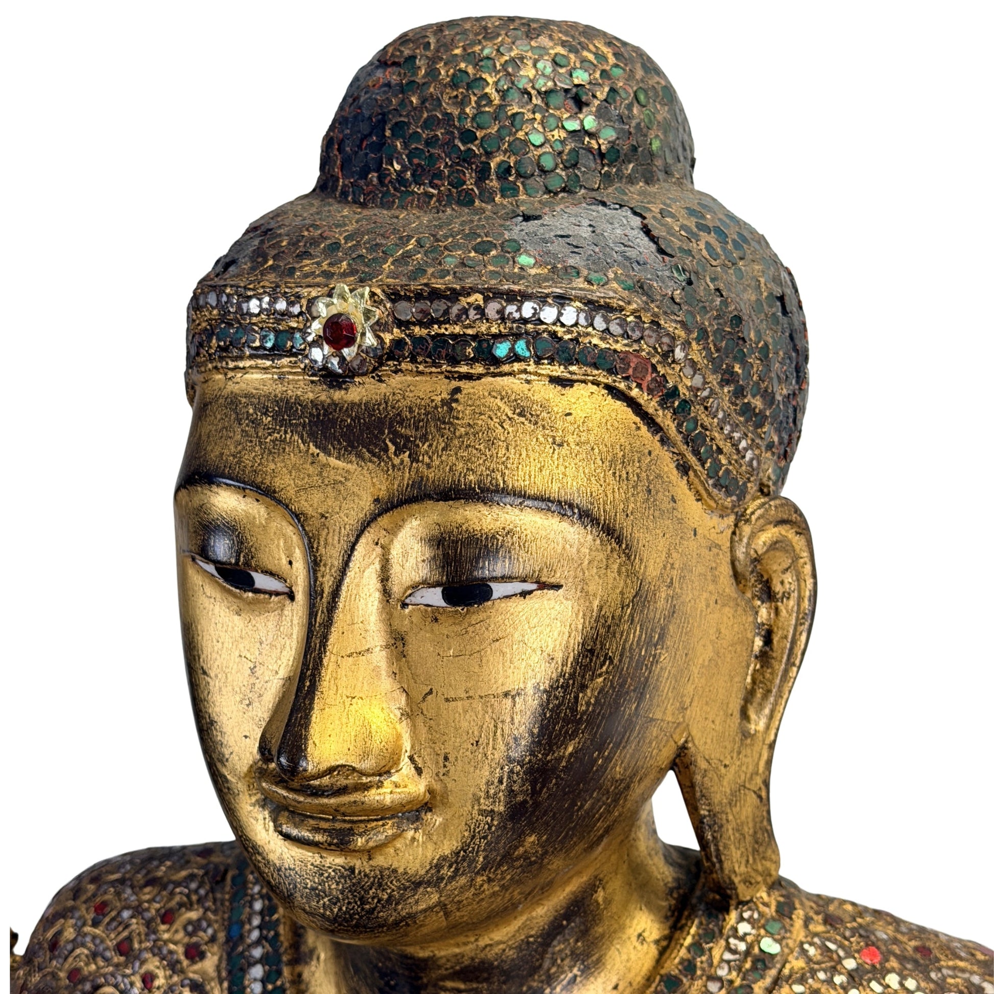 Mandalay Buddha with traditional thit-si lacquer beneath the gilded surface