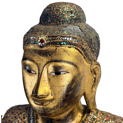 Mandalay Buddha with traditional thit-si lacquer beneath the gilded surface
