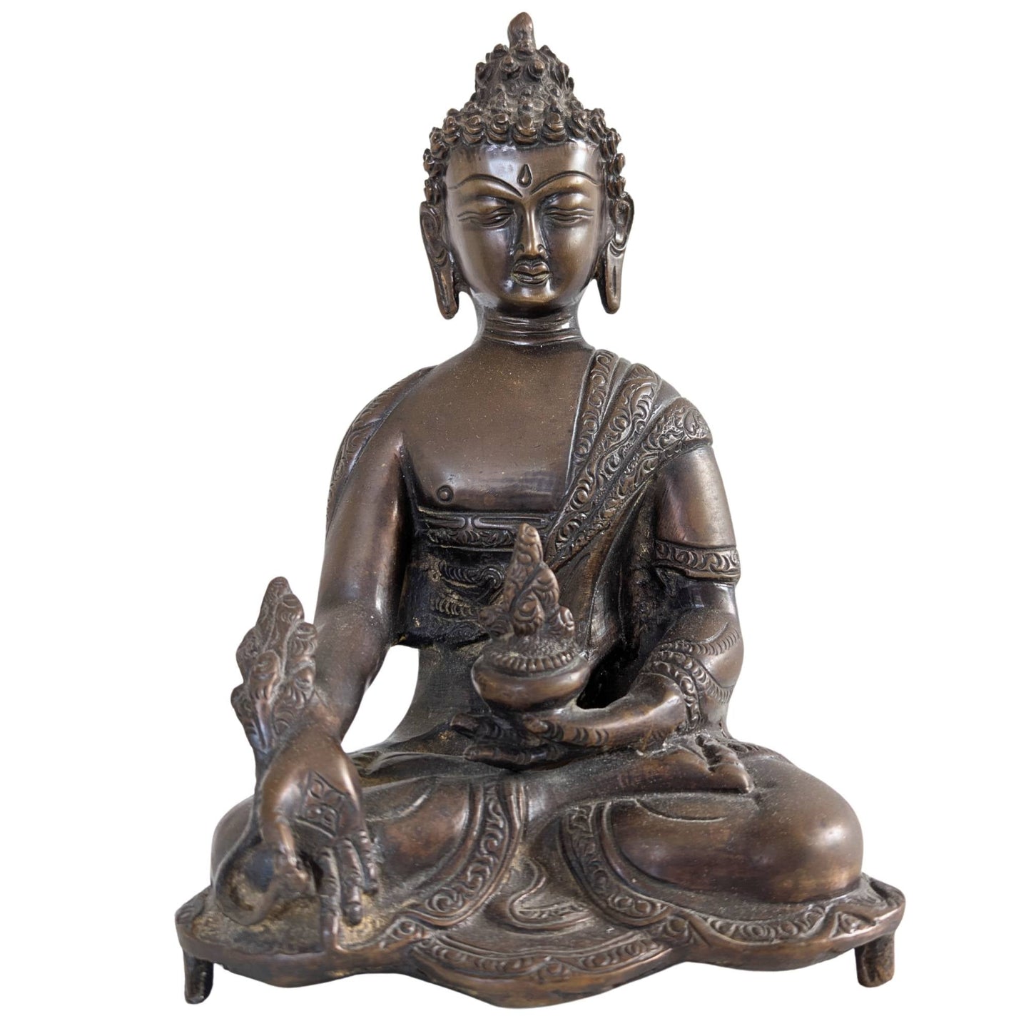 Vooraanzicht van een 23 cm hoog massief bronzen Medicijn Boeddha beeld uit Nepal.
