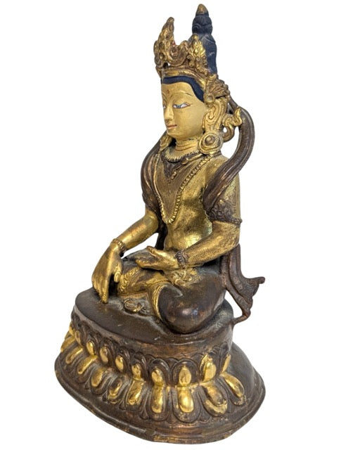 Seated Green Tara bronze showing the layered lotus pedestal