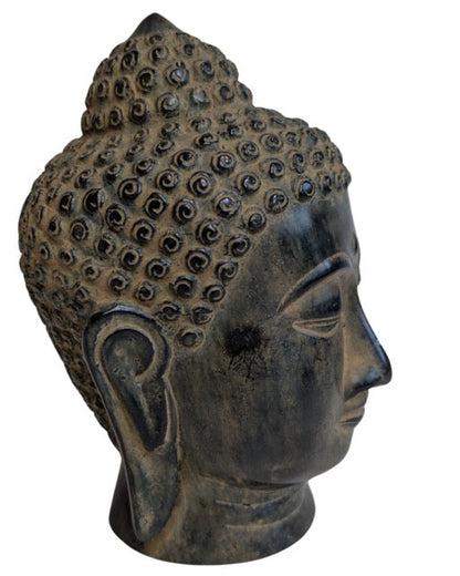 Serene facial features of the Southeast Asian bronze Buddha head