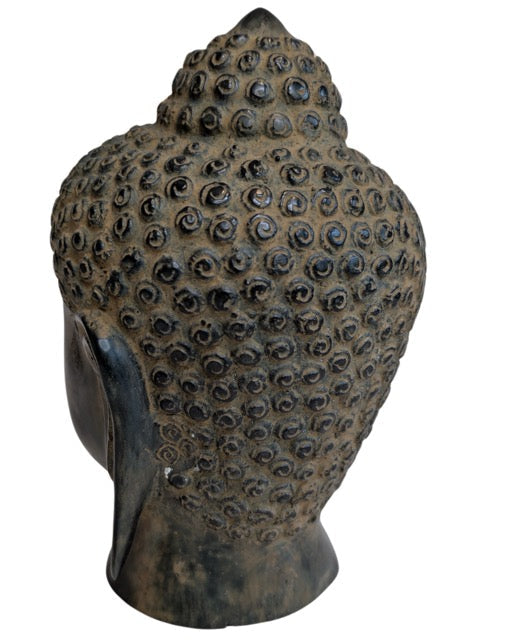 Opposite profile of the mid-20th-century bronze Buddha head