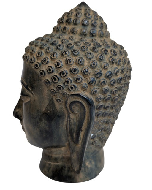 Dark natural patina on the Southeast Asian Buddha head