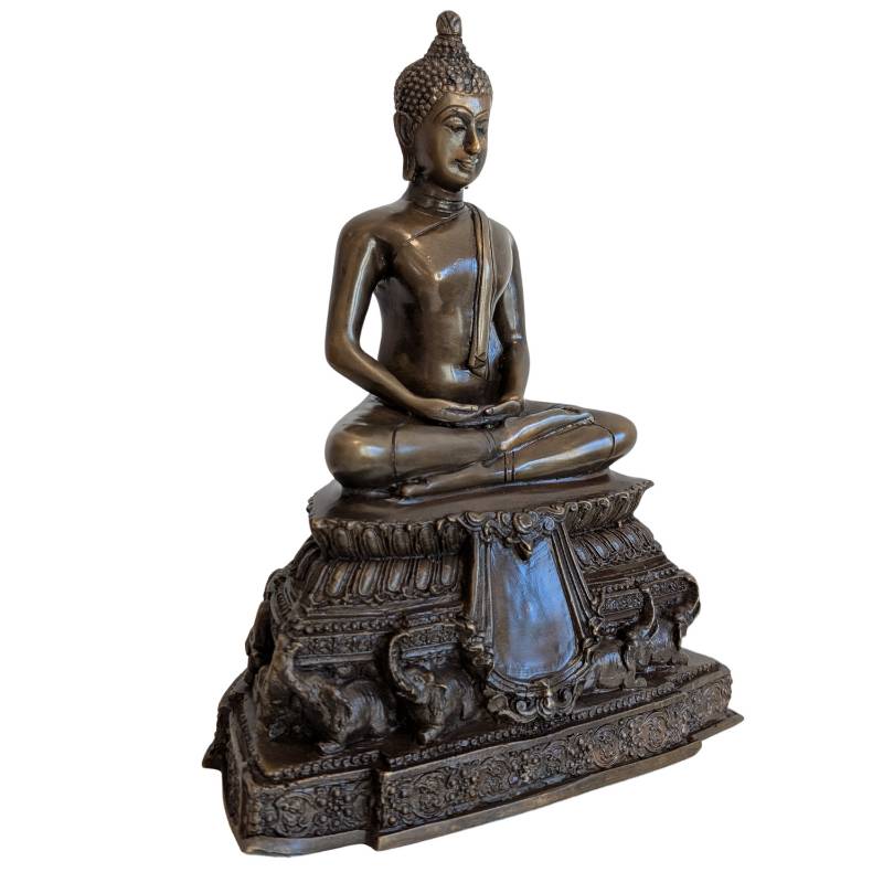 Three-quarter front view of Thai bronze Buddha and ornate elephant-supported base