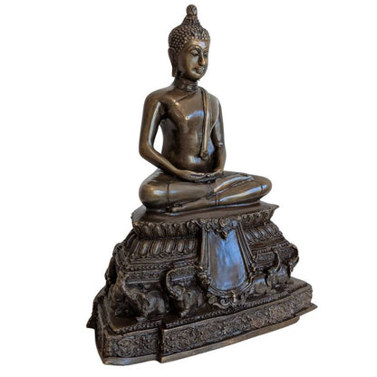 Three-quarter front view of Thai bronze Buddha and ornate elephant-supported base