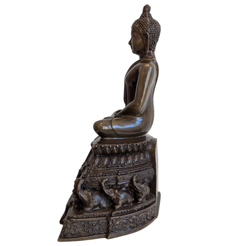 Opposite side profile of Thai meditation Buddha on ornate bronze pedestal
