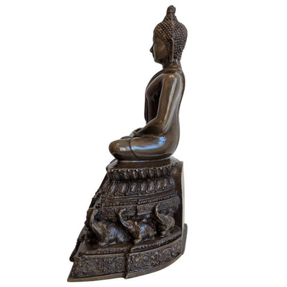 Opposite side profile of Thai meditation Buddha on ornate bronze pedestal