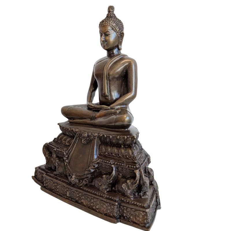 Three-quarter front view showing lotus borders and elephants on the pedestal