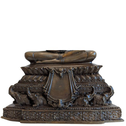 Close view of the elephant-supported pedestal with lotus and floral ornament