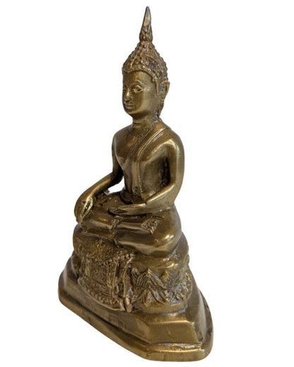 Aged gilt bronze surface of the seated Thai Buddha