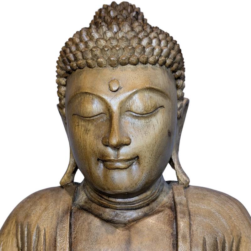 Thai wooden meditation Buddha with rounded facial features