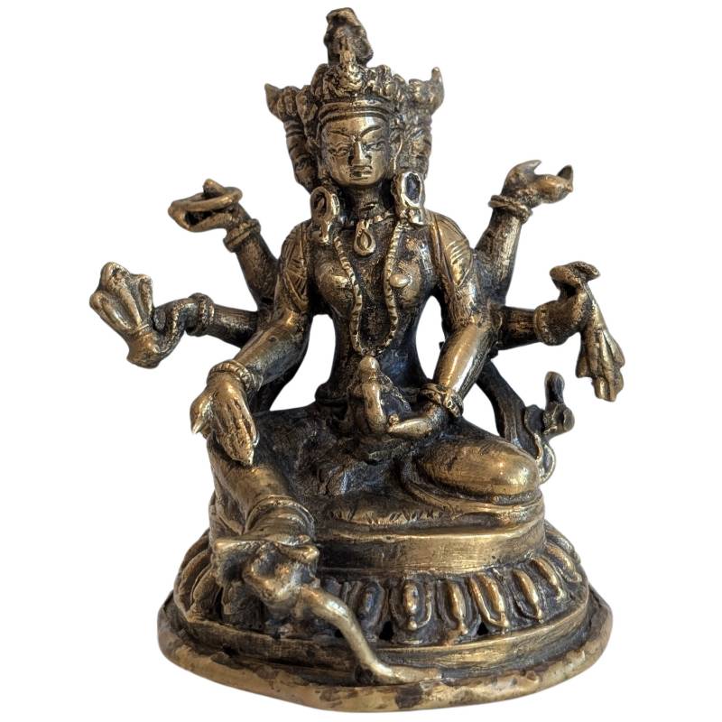Three-faced, eight-armed bronze Ushnishavijaya seated on a lotus base, front view