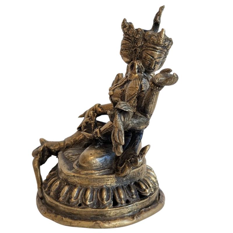 Three-faced bronze Ushnishavijaya with eight arms, rear three-quarter view