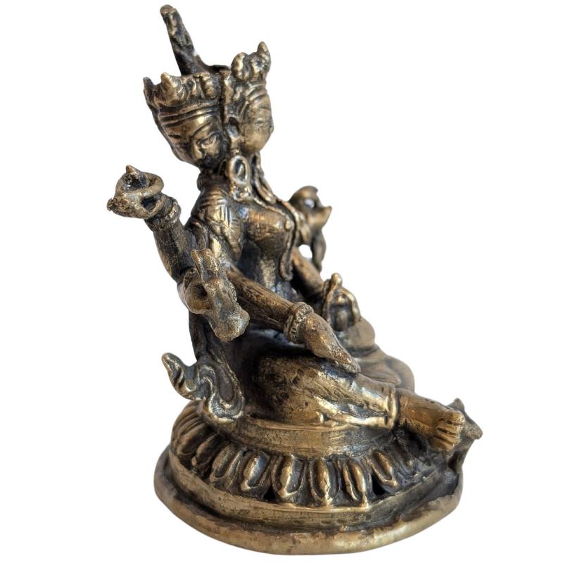 Bronze Ushnishavijaya with multiple arms and three faces, side view
