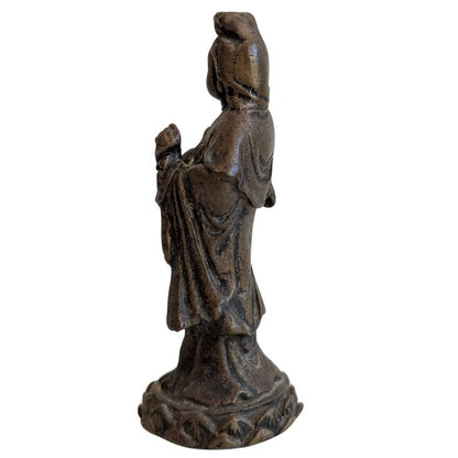 Left profile of the standing Chinese Guanyin holding a small sacred object