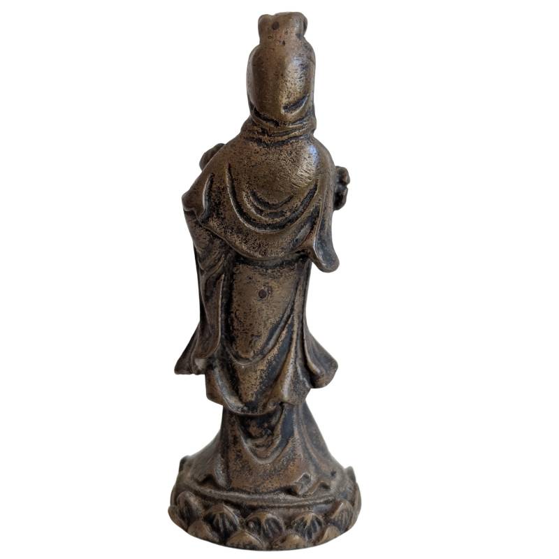 Rear view showing the Guanyin's robe folds and dark aged bronze surface