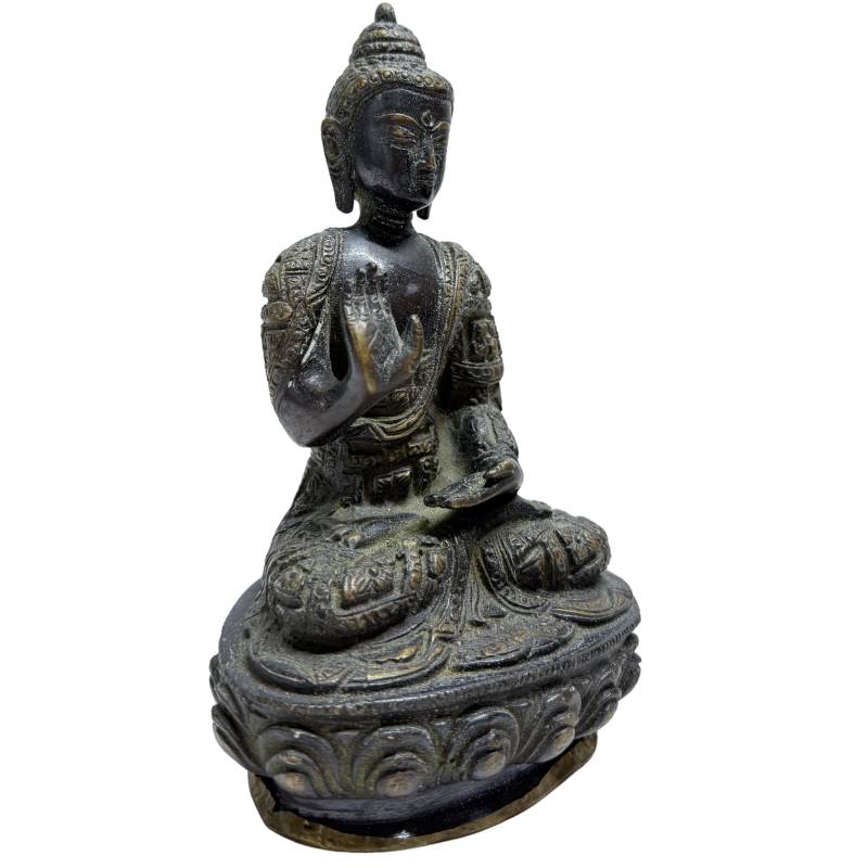 Nepalese fire-gilt bronze Buddha with raised hand in Abhaya Mudra, front angle