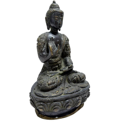 Nepalese fire-gilt bronze Buddha with raised hand in Abhaya Mudra, front angle