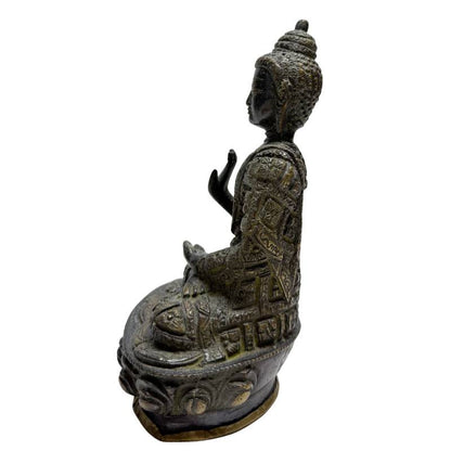 Opposite side angle of Nepalese Buddha with raised Abhaya hand
