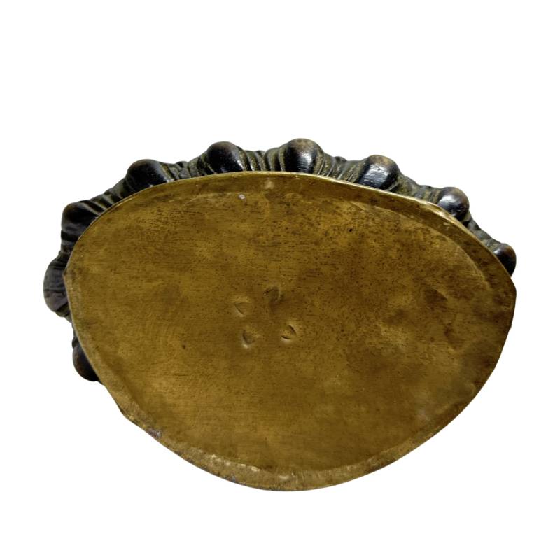 Closed underside plate of one Nepalese fire-gilt bronze Buddha