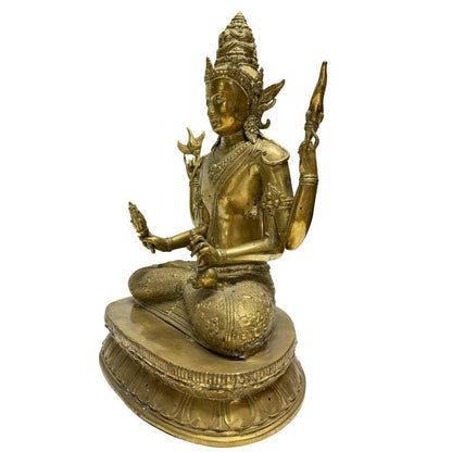Left-front view of the four-armed Avalokiteshvara seated on a lotus base