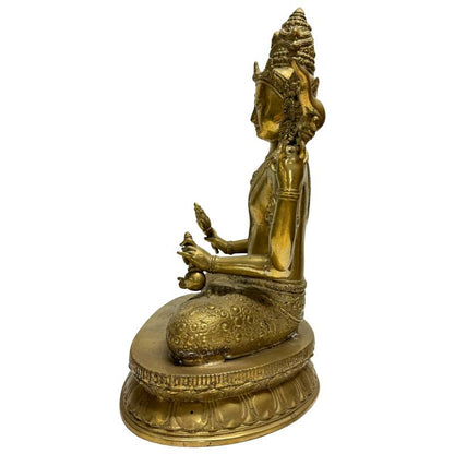 Left profile of the seated Nepalese Avalokiteshvara holding ritual attributes