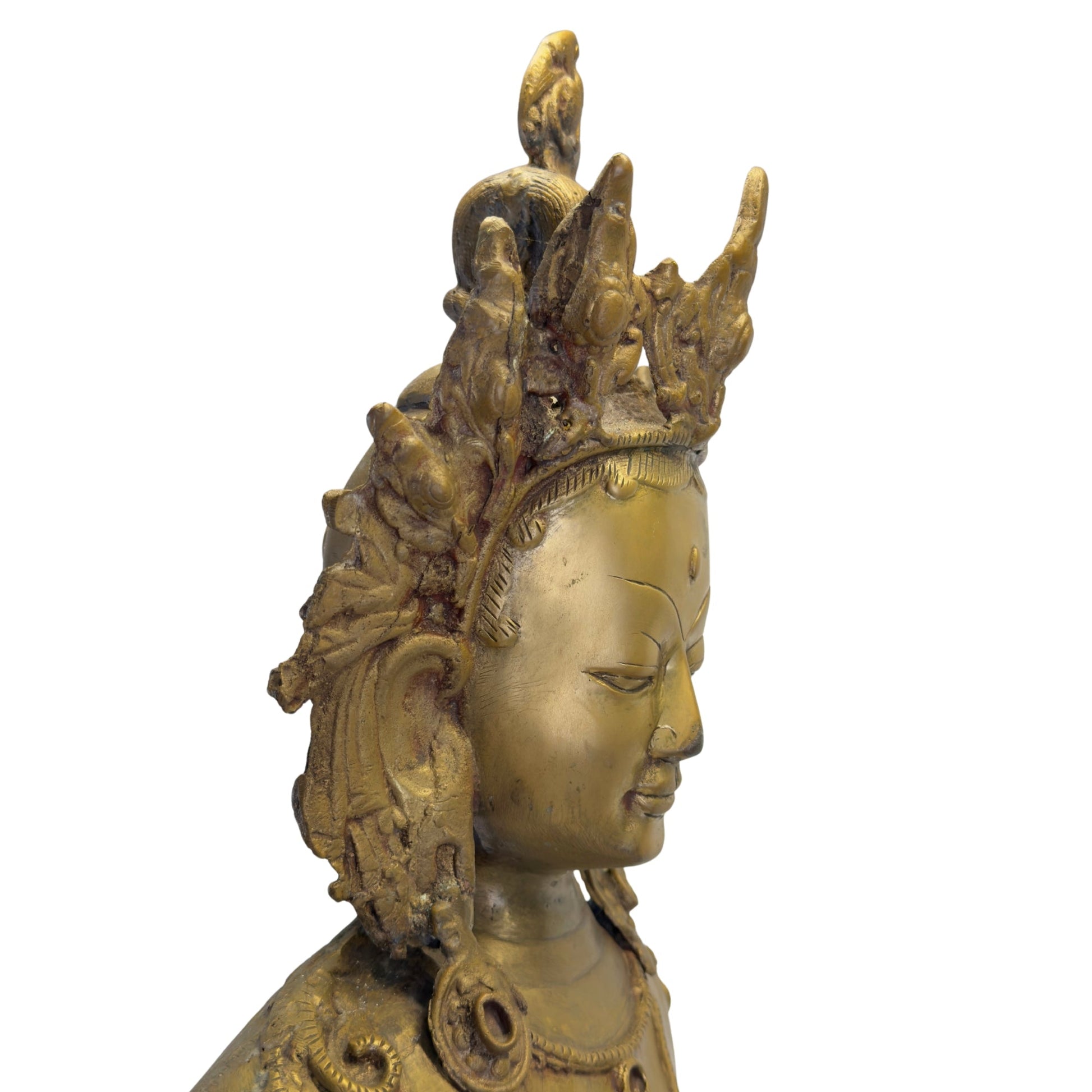 Profile detail of the richly worked crown of the antique Nepalese Green Tara