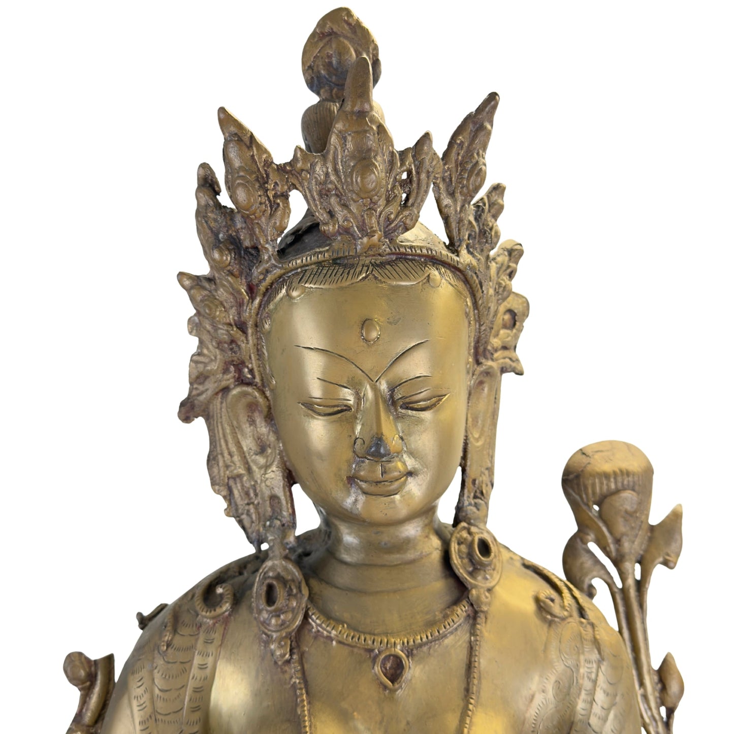 Face, crown and surviving historic gilding on the antique Nepalese Green Tara