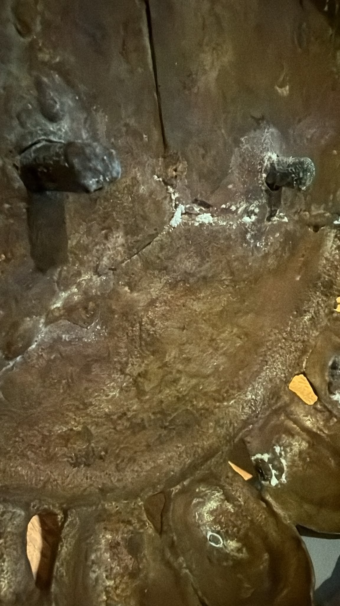 Underside of the lotus base of the antique Nepalese Green Tara showing construction details