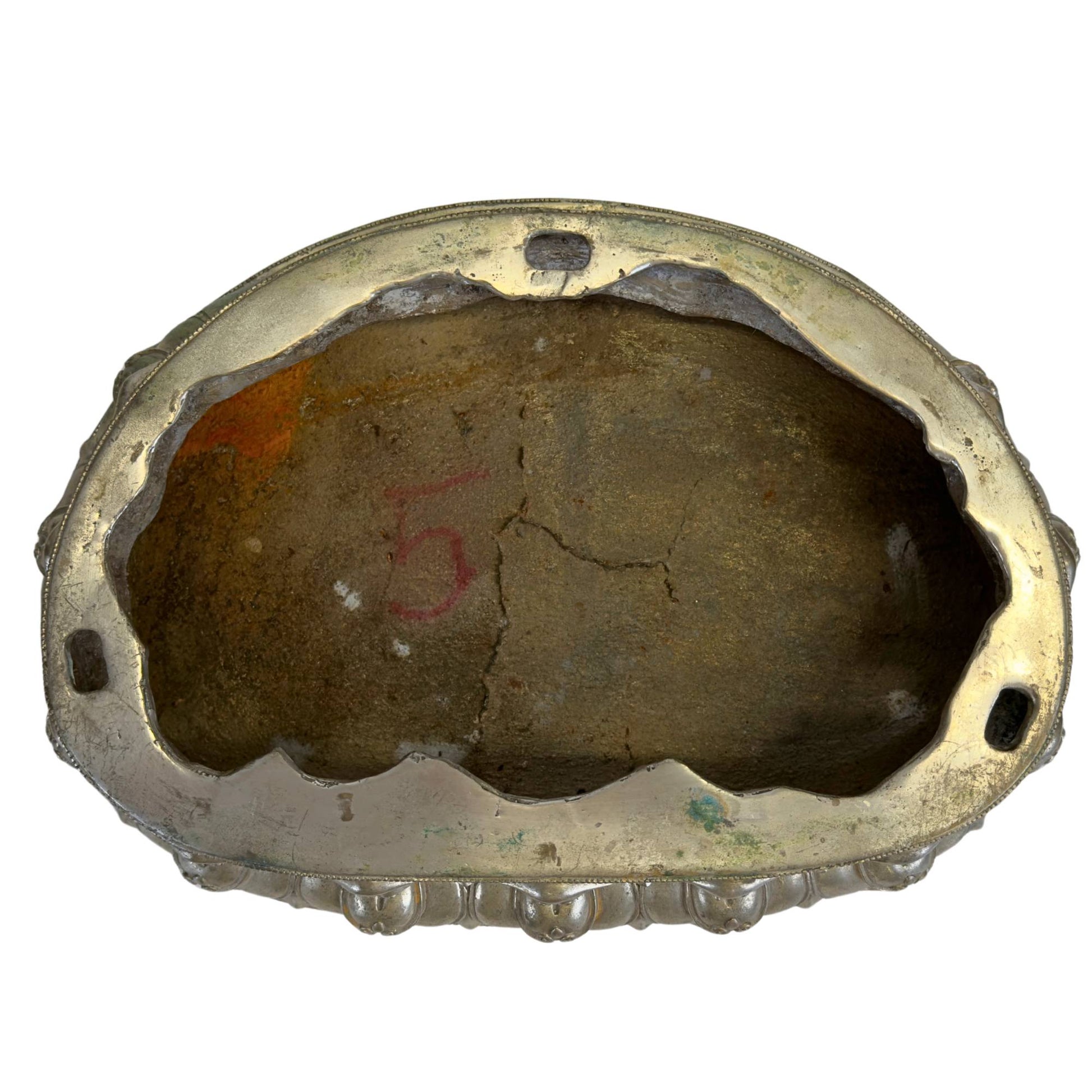 Interior of the detachable lotus base showing the historic casting core and construction
