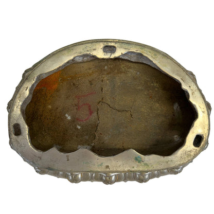 Interior of the detachable lotus base showing the historic casting core and construction