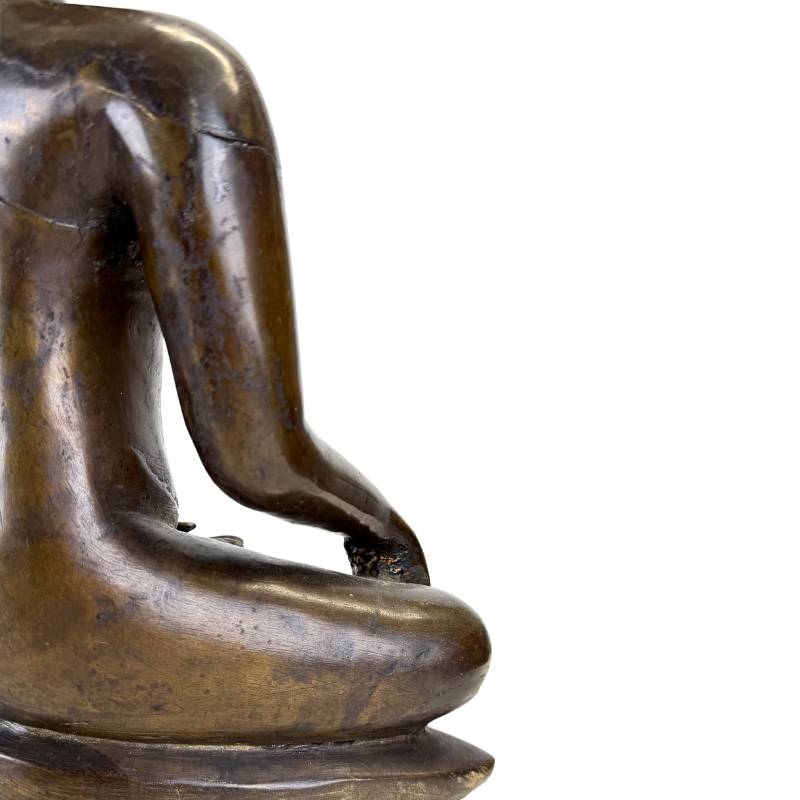 Rear arm detail of the Northern Thai bronze Buddha showing the historic casting seam, age-related fissures and dark bronze patina
