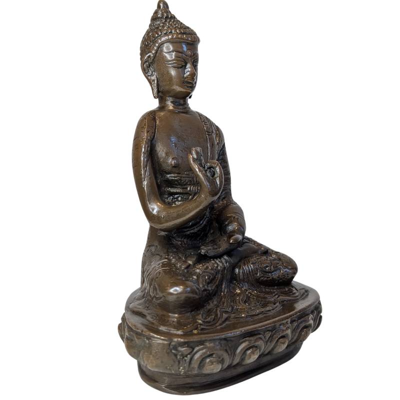 Front-right view of seated bronze Buddha in Vitarka Mudra on lotus base
