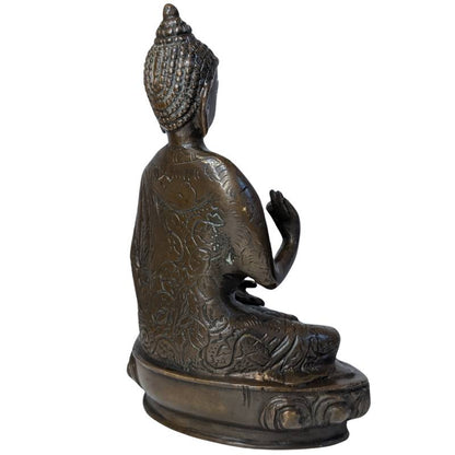 Rear-right view of seated bronze Buddha showing decorated robe and raised hand