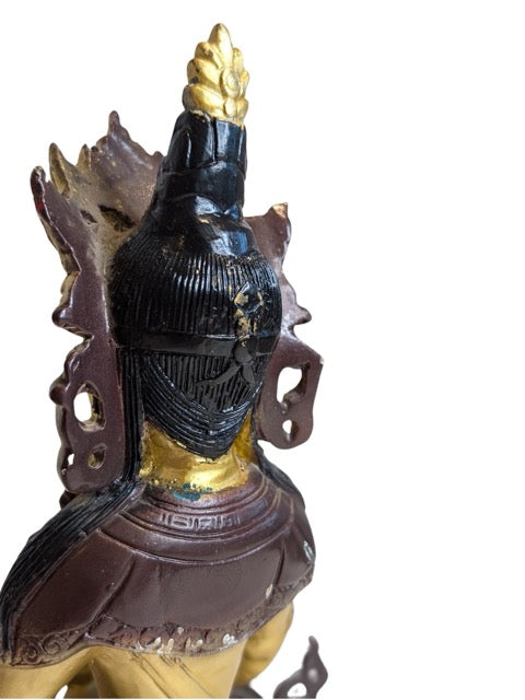Celestial ornaments decorating the seated Tara
