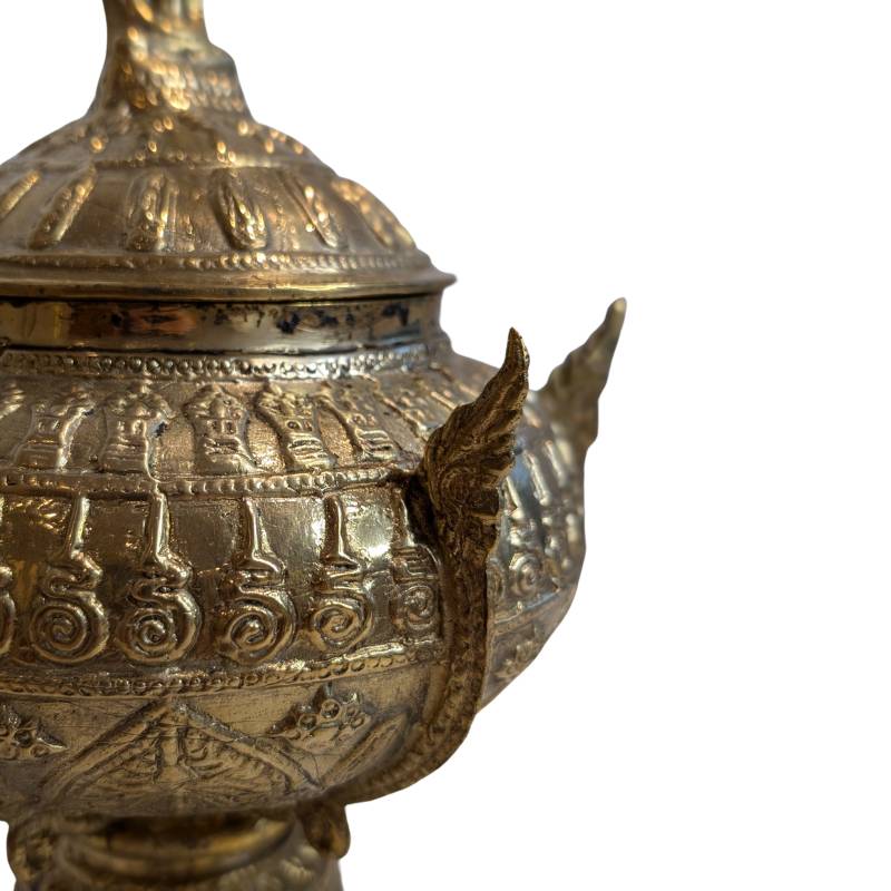 Protective serpent detail decorating the bowl lid