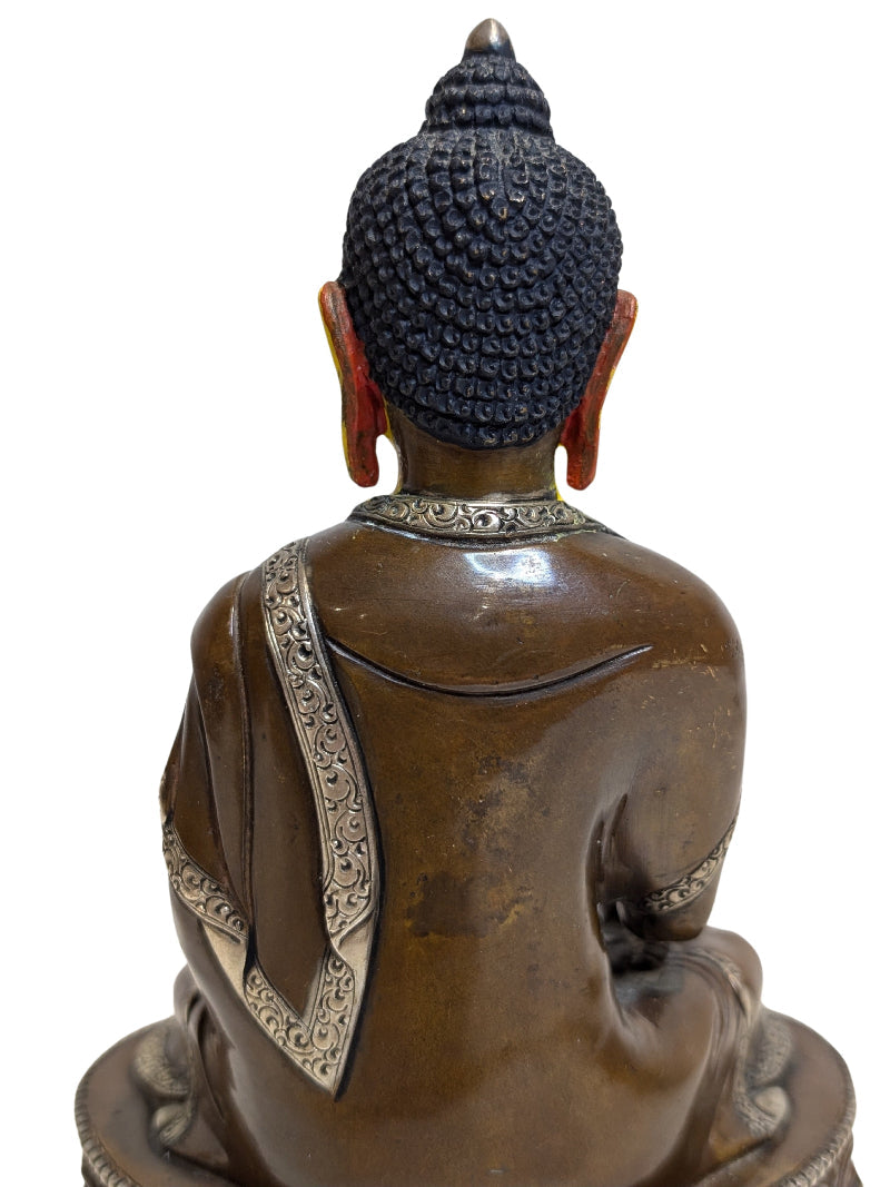Well-defined robes on the Tibetan bronze figure