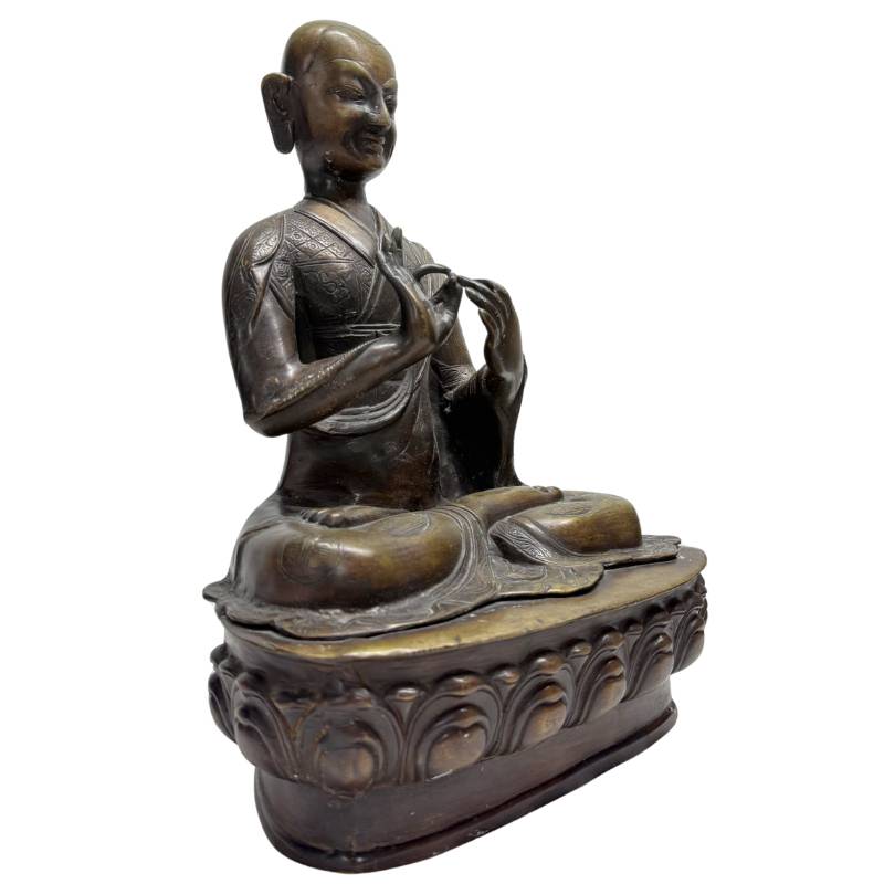Old Tibetan Lama – Heavy Bronze on Lotus Base, 38 cm – three-quarter front view
