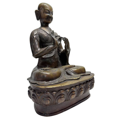 Old Tibetan Lama – Heavy Bronze on Lotus Base, 38 cm – three-quarter front view
