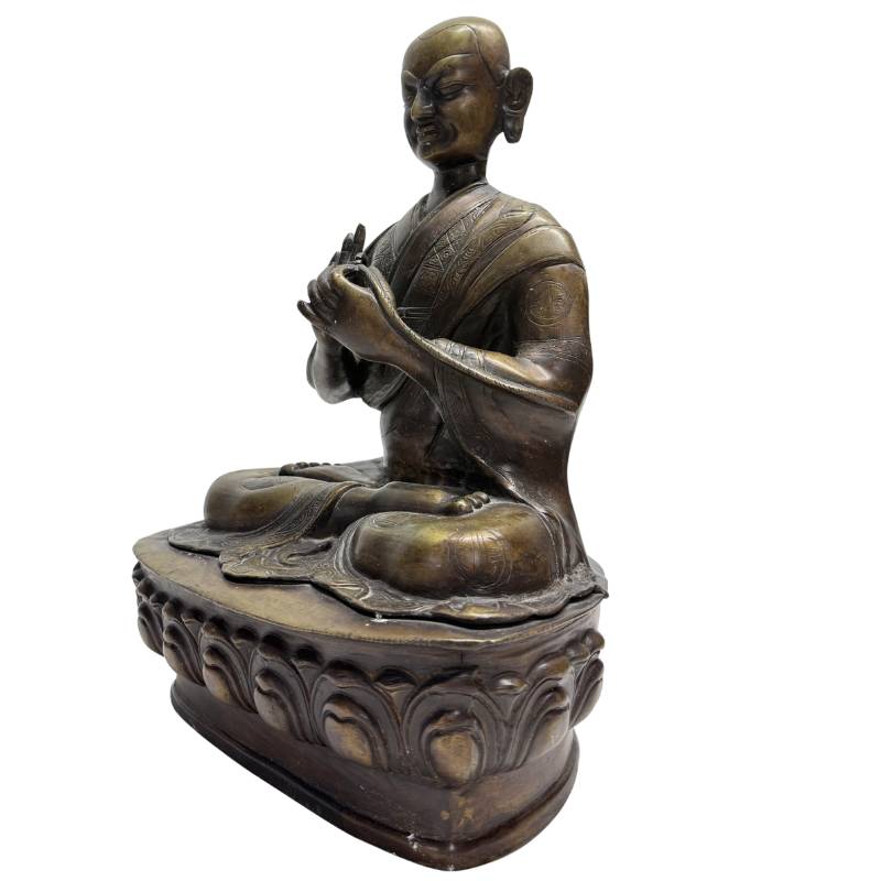 Old Tibetan Lama – Heavy Bronze on Lotus Base, 38 cm – opposite three-quarter front view