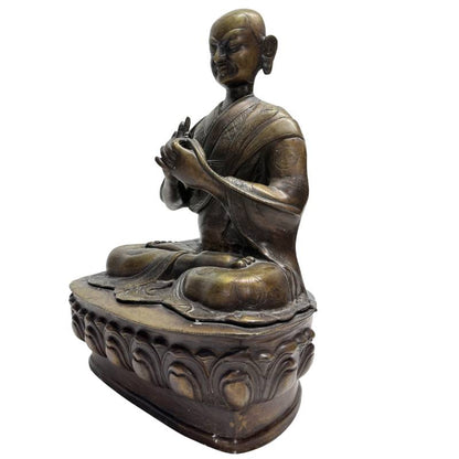 Old Tibetan Lama – Heavy Bronze on Lotus Base, 38 cm – opposite three-quarter front view