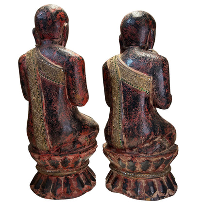 Closer rear view of pair of Thai Thapanom figures with gilded robe panels