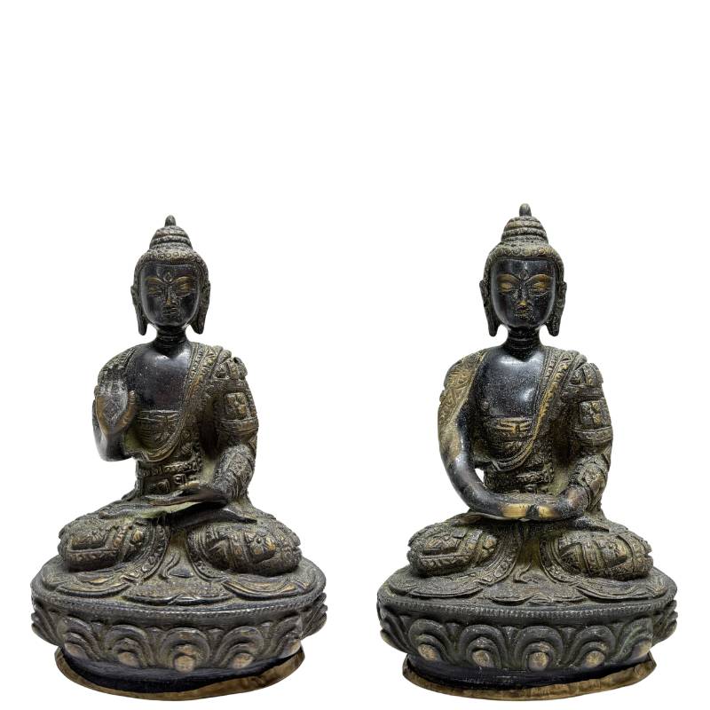 Pair of Nepalese fire-gilt bronze Buddhas on lotus bases, front view