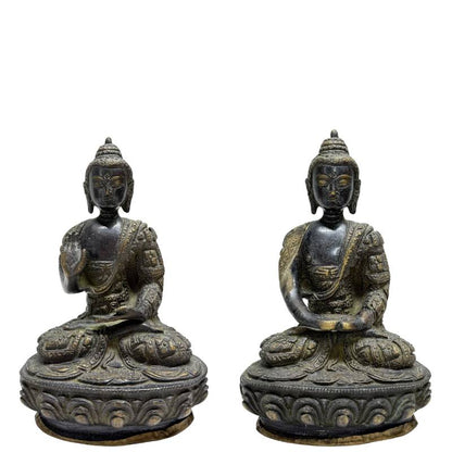 Pair of Nepalese fire-gilt bronze Buddhas on lotus bases, front view