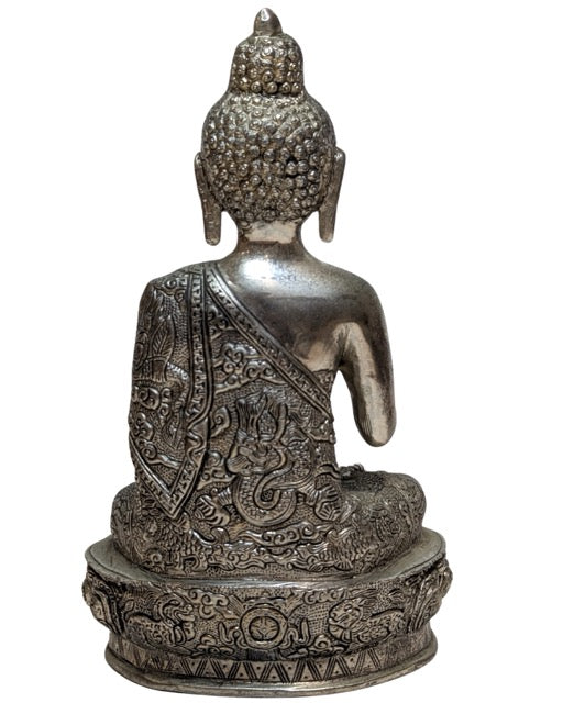 Dragon motifs engraved on the Nepalese Buddha's robe