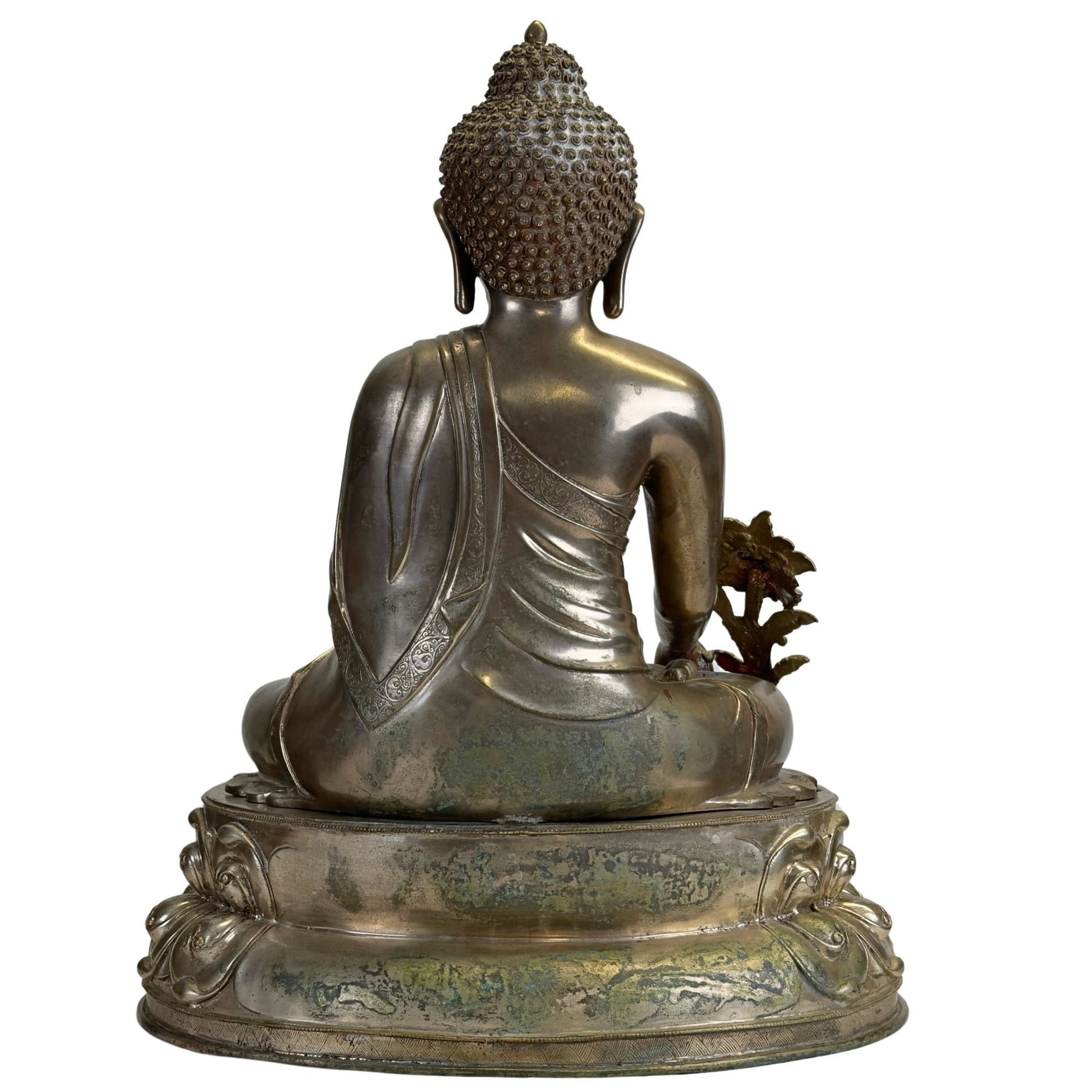 Rear view of the silvered Newar Bhaisajyaguru showing the engraved monastic robe